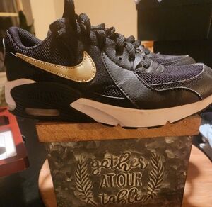 Black and gold leather Boys Nike shoes